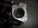 Throttle body attaches to this flange